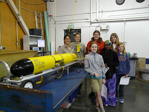 Class poses for a photo with the glider
