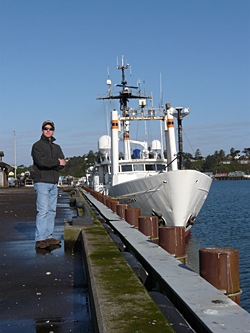 Jeff standing next to the R/V Wecoma